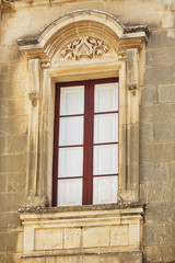 Fototapeta na wymiar Old textured wall with window