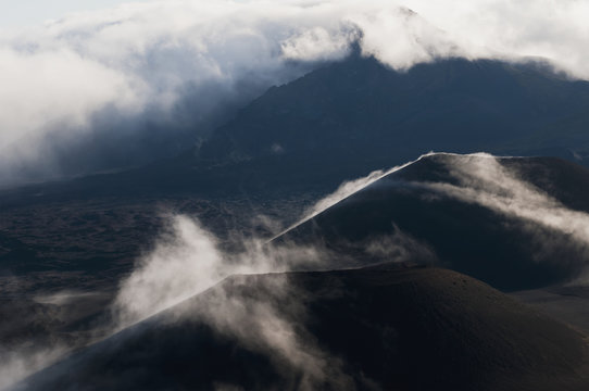 Morning clouds begin to burn off of Haleakala National Park; Maui, Hawaii, United States of America