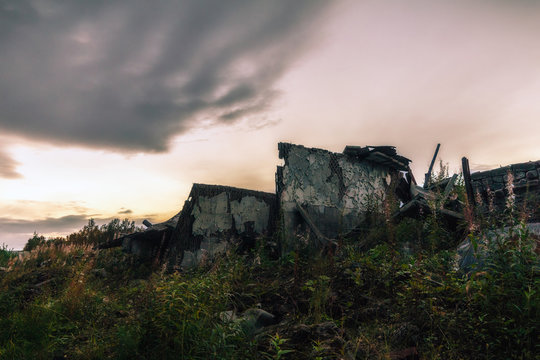 Apocalyptic landscape.The remains of the destroyed buildings in the background of dark sky