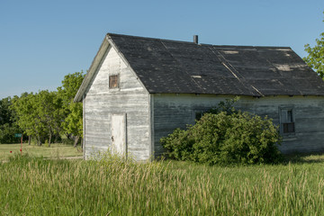 Fototapeta na wymiar Barn in a field, Manitoba, Canada