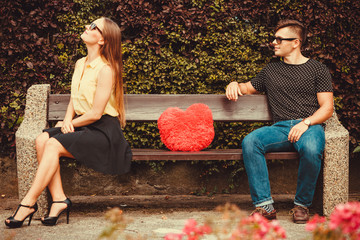 Upset girl on bench with boy.