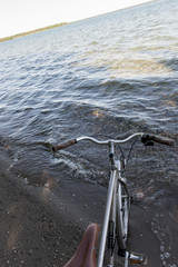 Fototapeta na wymiar Bicycle on the beach, Wasagaming, Riding Mountain National Park,