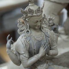 Statue with four arms at Thirteen Arts and Crafts School in Bhutan