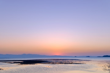 Fototapeta na wymiar ebb tide and sunset at Bakunyai island, Satun province , Thailan