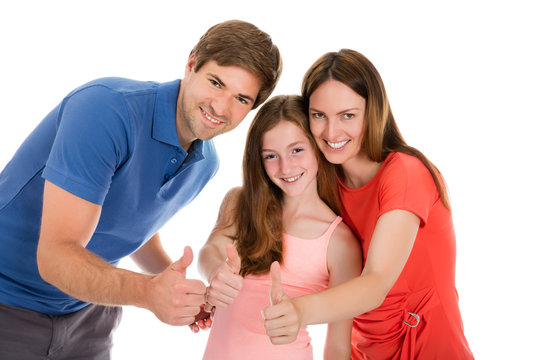 Happy Family Gesturing Thumbs Up