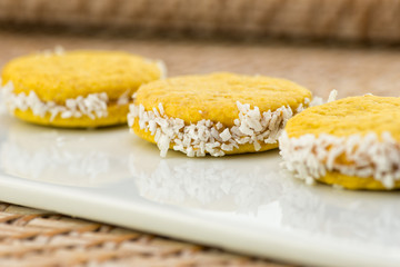 Vegan sweet biscuits with coconut on a white plate