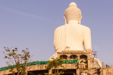 Fototapeta premium Back view of Phuket Big Buddha Statue while surrounding area under construction, Phuket, Thailand