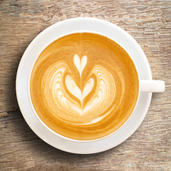 Cup of coffee latte art on wood table