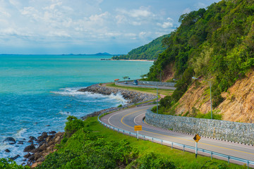 Beatiful curve road and sea with blue sky and clouds at Khung Wiman Beach, Chantabuti, Thailand