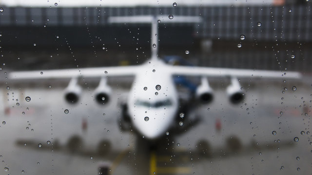 View of the front of an aircraft through a wet window; Munich, Germany