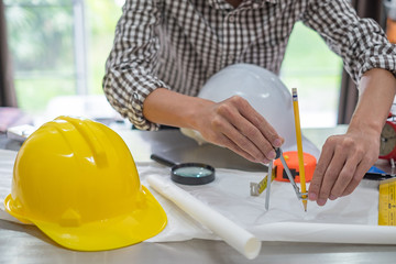 Image of engineer meeting for architectural project, working with partner and engineering tools on workplace