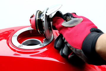 Men turn key motorcycle fuel tank.