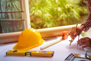  engineer meeting for architectural project. working with partner and engineering tools on workplace 