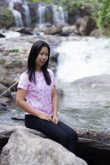 Thai woman with Mae Ya waterfall, Chiangmai Thailand