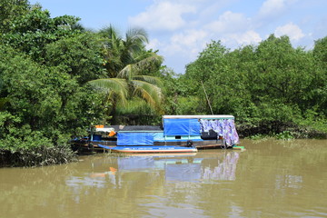Fototapeta premium traditional asian fishing boat in river
