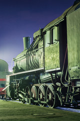 Old steam locomotive at night