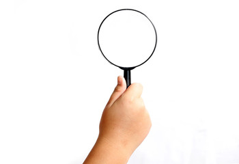 Boy hand holding magnifying glasses