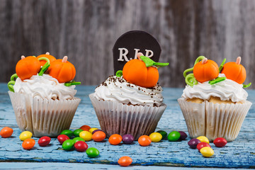 Halloween cupcakes with colored decorations