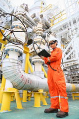 operator recording operation of oil and gas process at oil and rig plant, offshore oil and gas...