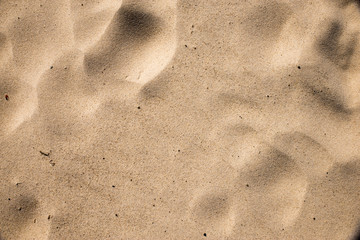 closeup of sand pattern of a beach in the summer