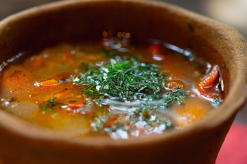 Hungarian national dish - bogracs, close up in bread plate