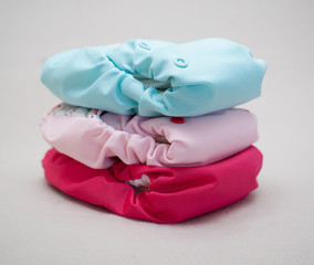 Stack of cloth diapers different colors