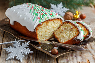 Piece of almond cake with Christmas decorations.