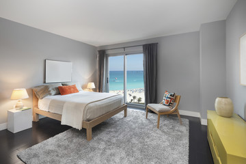 Grey bedroom with ocean sea view.