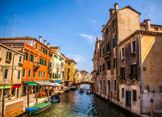 VENICE, ITALY - AUGUST 18, 2016: Famous architectural monuments and colorful facades of old medieval buildings close-up on August 18, 2016 in Venice, Italy.