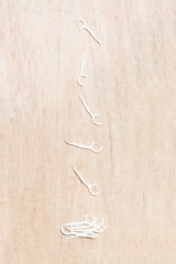 Oral Device : Dental flossers on wooden background