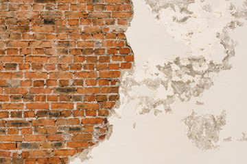 Old broken wall from red brick and white concrete, background, texture