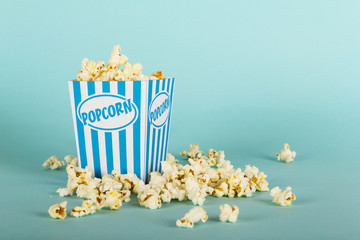 Popcorn bucket against a blue background