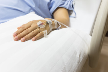 Asian Pregnant Woman patient is on drip receiving a saline solut