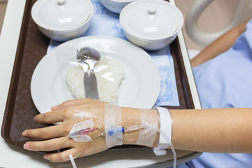 Asian Pregnant Woman patient is on drip receiving a saline solut