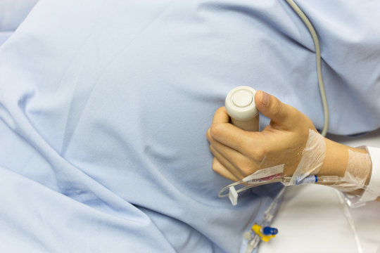 Asian Pregnant Woman patient is on drip receiving a saline solut