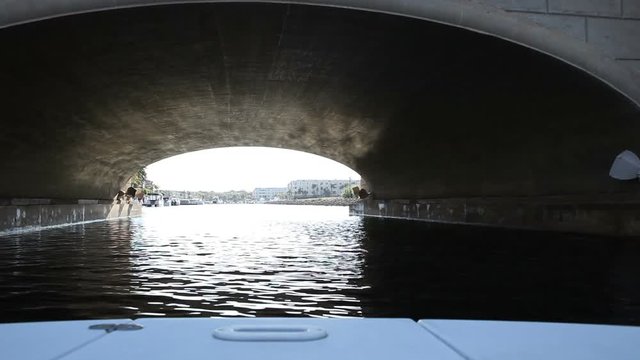 A front view off the bow of a boat in the harbor.