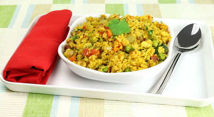 Indian vegetarian food, aval upma, also known as poha upma, made from ground flattened rice and vegetables.
