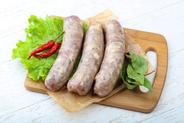 Raw sausages for cooking