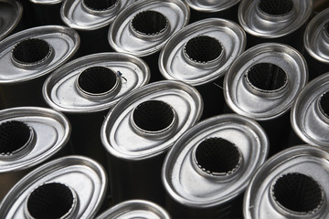 Industrial background. Stacks of new exhausts and silencers mufflers car before distribution and...