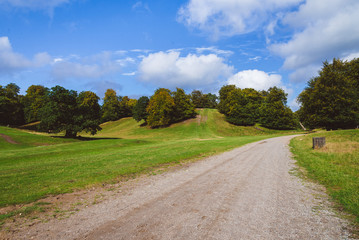 Fototapeta na wymiar Green Meadow, Hills and Path in Jaegersborg, Copenhagen.