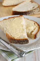 Traditionally baked white bread sliced and buttered