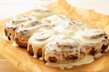 Cinnamon buns glazured with cream cheese  .
