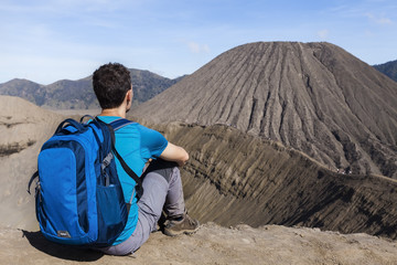Person watching crater and caldera of Bromo volcano, Java, Indonesia