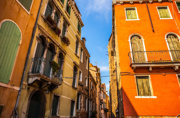 VENICE, ITALY - AUGUST 18, 2016: Famous architectural monuments and colorful facades of old...