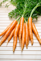 Fresh carrots on the gray backgrounds.