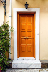 Fototapeta na wymiar Wooden yellow front door