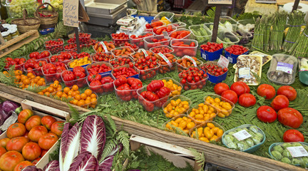 Fresh tomatoes for sale at a traditional Italian market. Concepts could include food, health, culture, travel, and others. - 122226084