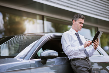 Businessman connecting with his tablet