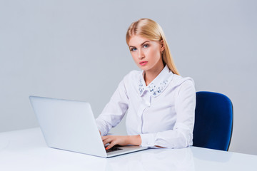 Young businesswoman working at laptop computer.