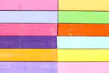 Bunch of square colorful pastel chalks closeup background